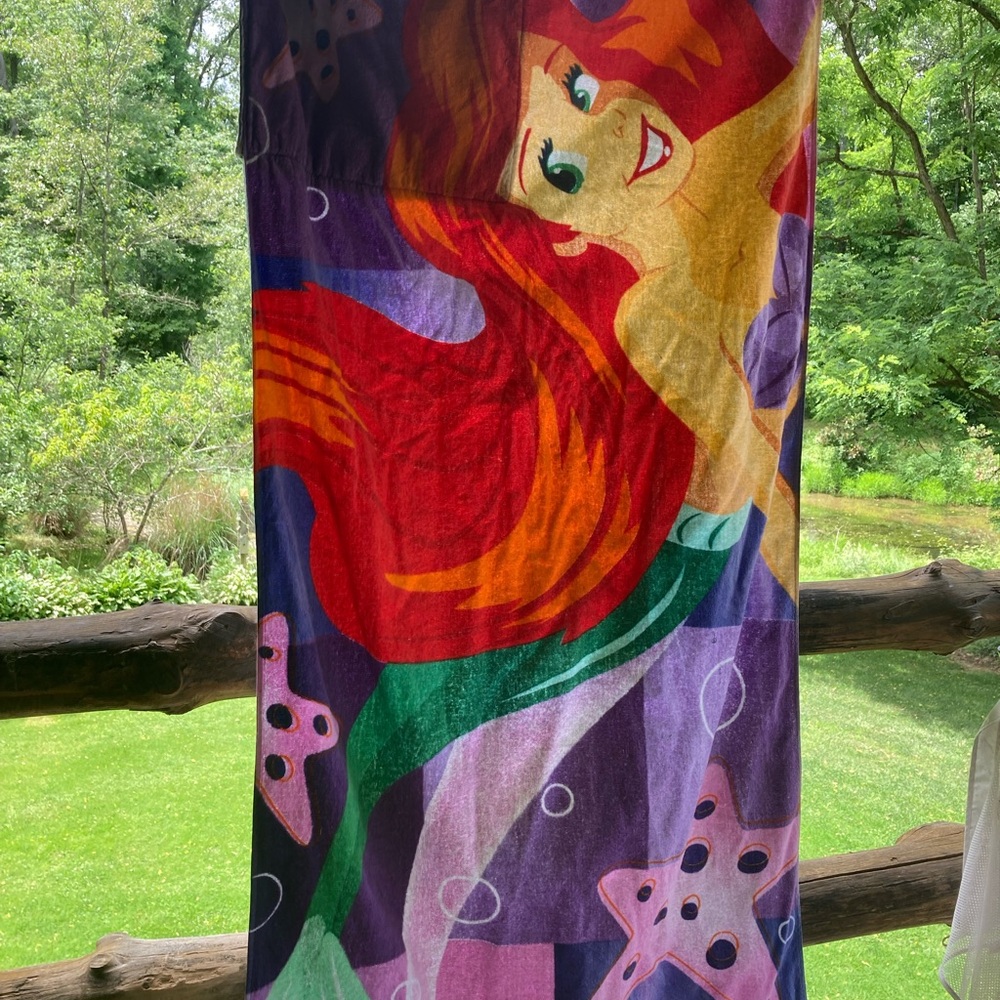 Little mermaid beach towel, Ariel. Folds into a small pillow with built-in area